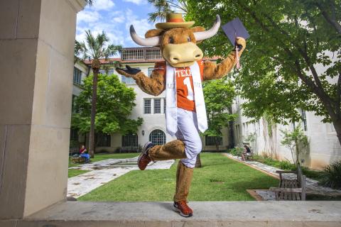 Hook Em wearing white stole